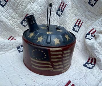 Small metal gas can painted in an Americana theme with Olde Glory flag on it