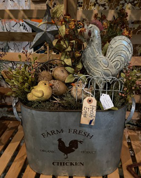 Tin imprinted Farm Fresh chicken. Metal chicken, star, eggs, and chicks in the tin