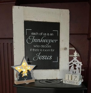 Sing that says each of us is an Innkeeper who decides if there is room for Jesus, two small nativity scenes one with light the other a cube calendar