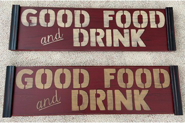 Two wooden signs with Red background that are stenciled with Good Food and Drink