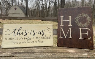 Two wooden stenciled signs